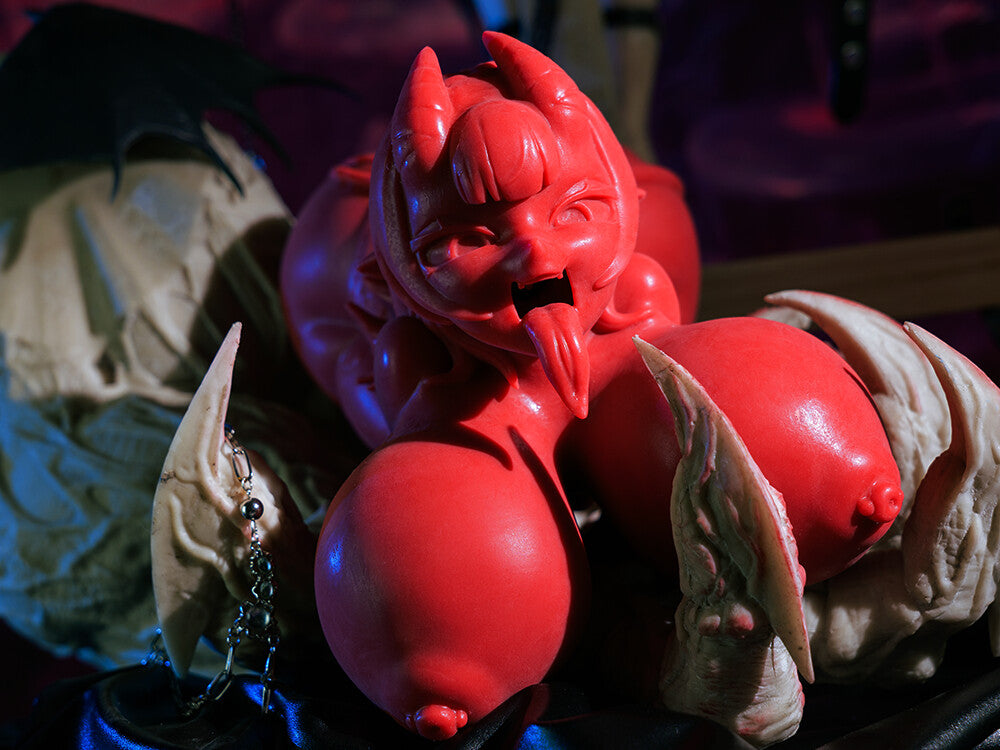 Image of Close-up of the Meru blowjob sex toy with a stylized red demon design.