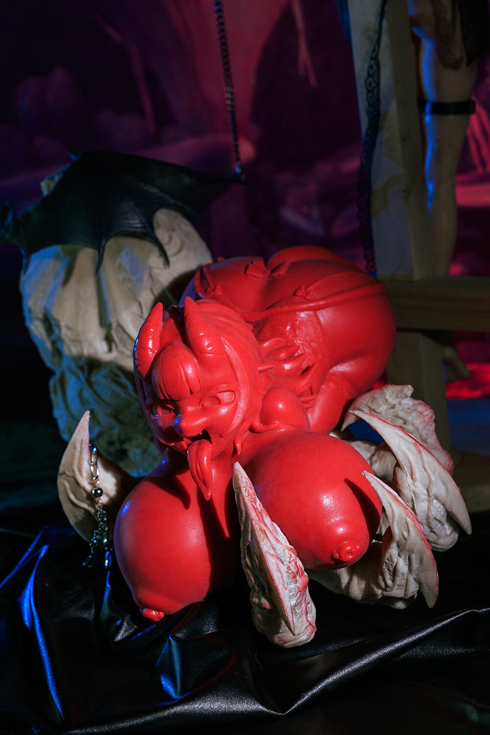 Full view of the red Meru succubus sex doll with big tits.