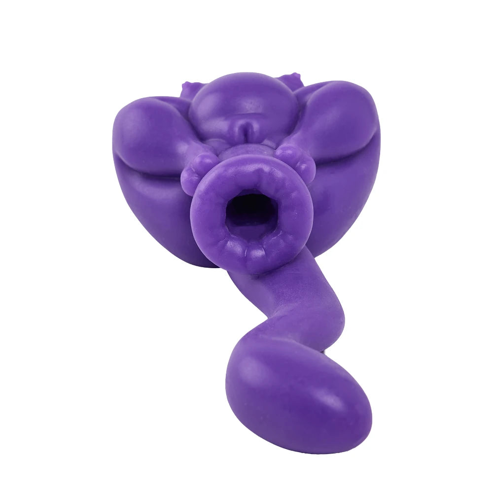 Image of Bottom view of Boinos silicone sex doll showing the channel opening and long purple tail