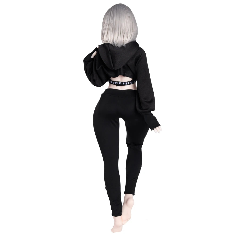 Image of Rear three-quarter view of Lily anime sex doll wearing a black hoodie and pants.